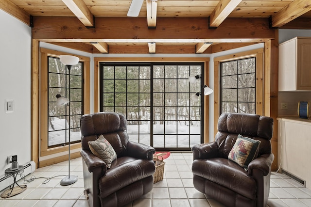 living area featuring light tile patterned floors, a baseboard heating unit, beamed ceiling, and wooden ceiling