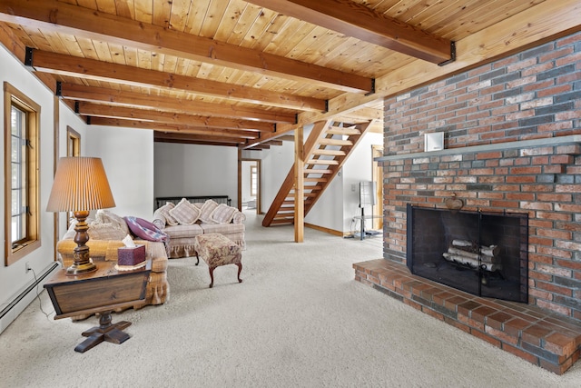 living room with a brick fireplace, beamed ceiling, stairs, carpet floors, and wooden ceiling