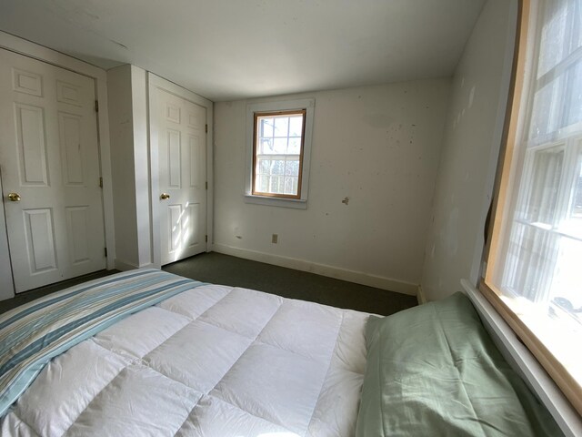 unfurnished bedroom with baseboards