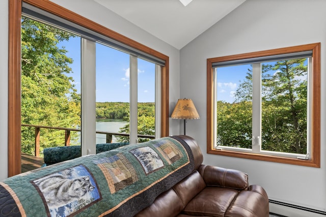 sitting room with a baseboard heating unit, vaulted ceiling, and a water view