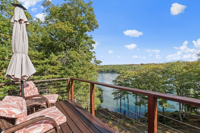 wooden deck with a water view