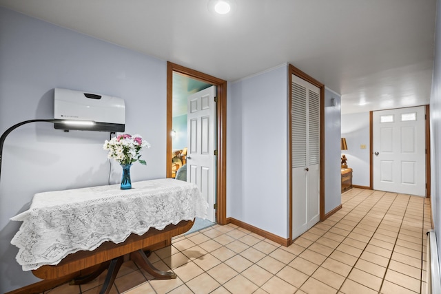 dining space with light tile patterned floors and baseboards