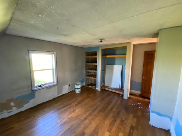 empty room featuring wood finished floors