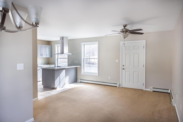 unfurnished living room with a baseboard heating unit, light colored carpet, baseboards, and ceiling fan