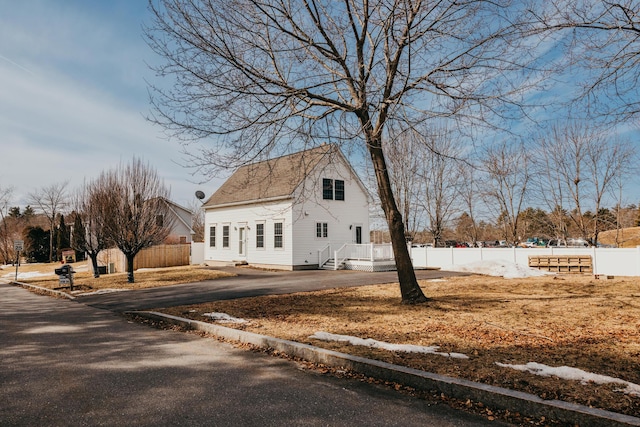 view of side of property with fence