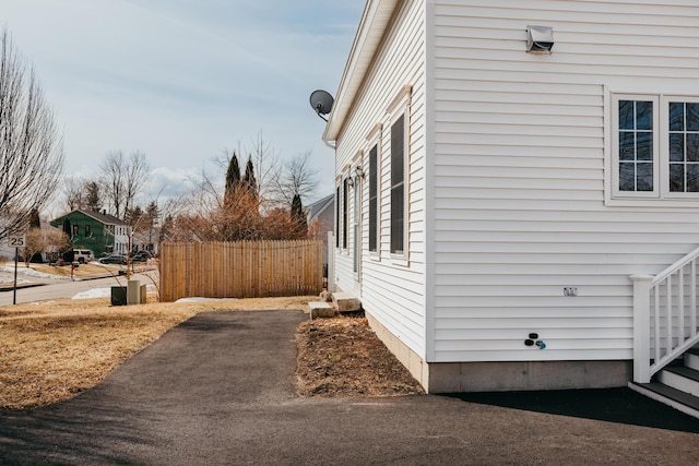 view of side of property with fence