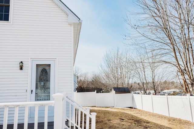 view of side of home featuring a fenced backyard