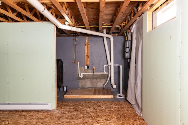 basement featuring a baseboard heating unit