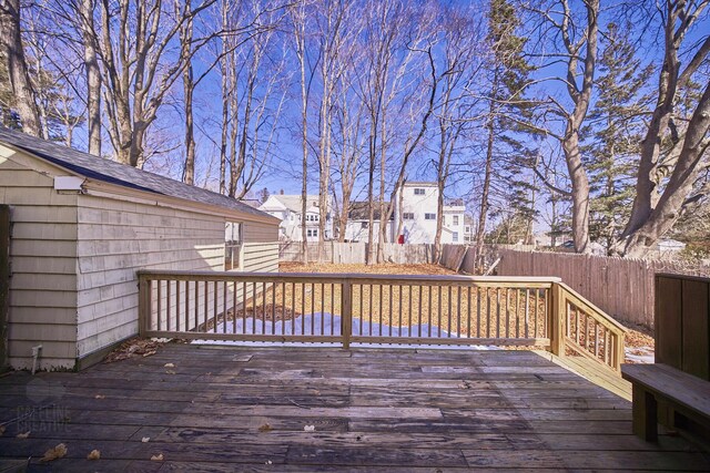 deck with a residential view and a fenced backyard