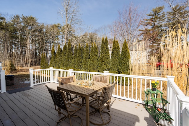 wooden deck with outdoor dining area