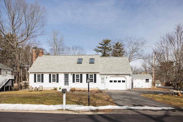 cape cod-style house featuring an attached garage, driveway, a chimney, and roof with shingles