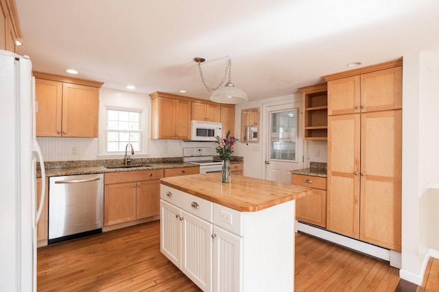 kitchen featuring a sink, open shelves, white appliances, butcher block counters, and light wood finished floors