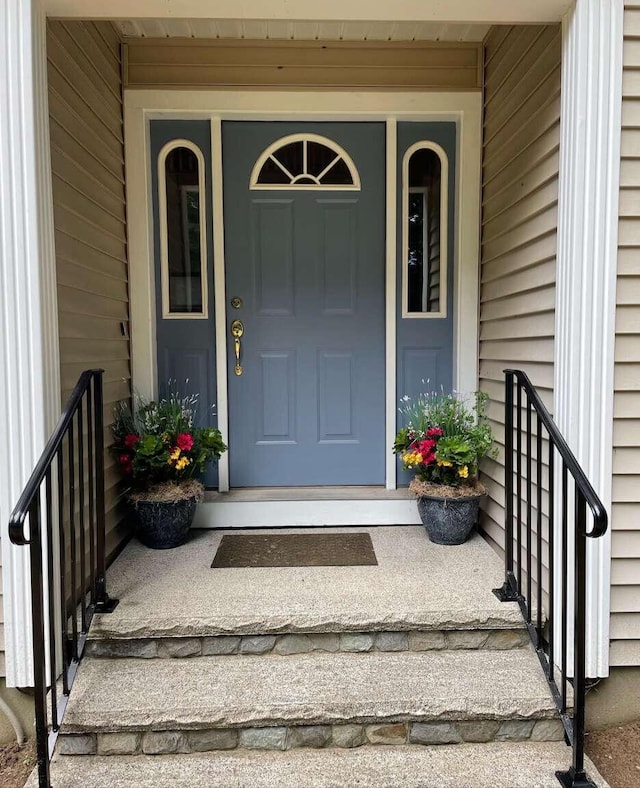 view of exterior entry with a porch