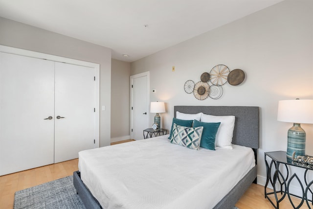 bedroom with a closet and wood finished floors