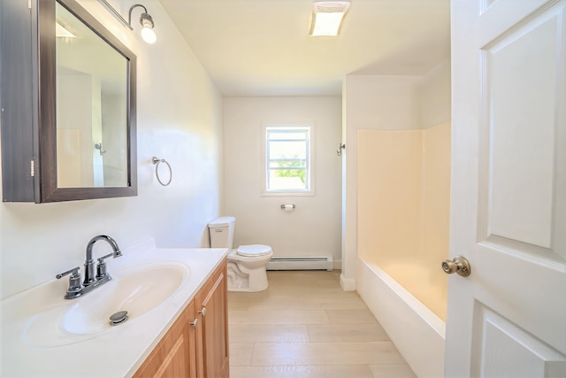 18 Oak St, Camden, ME 04843 - bathroom with a baseboard radiator, vanity, wood finished floors, and bathing tub / shower combination