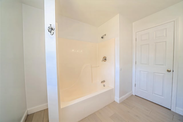 18 Oak St, Camden, ME 04843 - full bathroom featuring  shower combination and wood finished floors