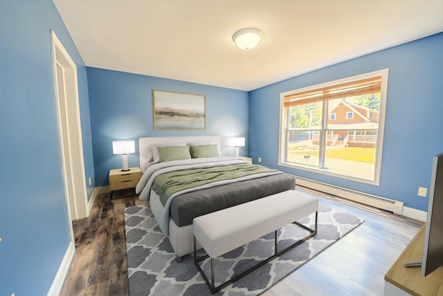 18 Oak St, Camden, ME 04843 - bedroom featuring a baseboard radiator and wood finished floors