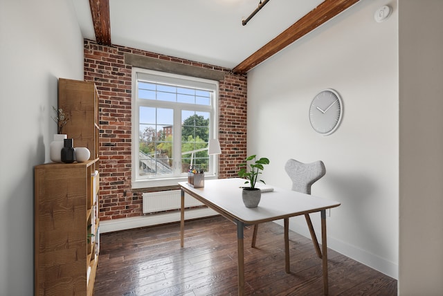 office area with beamed ceiling, radiator, brick wall, and wood-type flooring