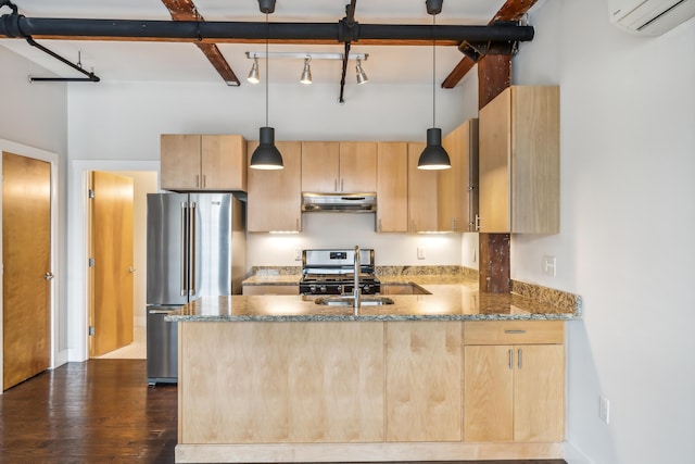 kitchen with under cabinet range hood, stainless steel appliances, light brown cabinetry, and a wall unit AC