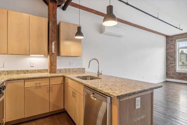 kitchen featuring brick wall, a wall unit AC, a peninsula, stainless steel dishwasher, and a sink