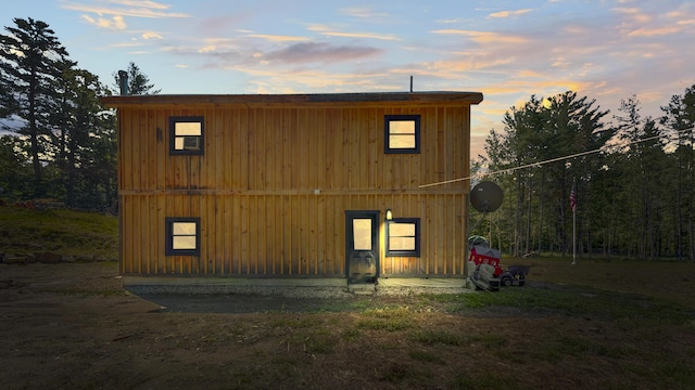 view of outdoor structure at dusk