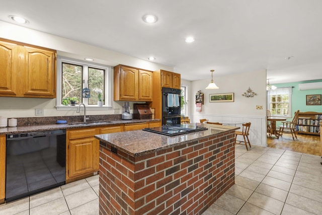 16 Rockaway Rd, Falmouth, ME 04105 - kitchen featuring a sink, a wall mounted AC, black appliances, dark stone counters, and a wainscoted wall