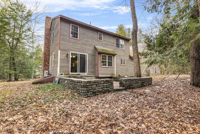 16 Rockaway Rd, Falmouth, ME 04105 - back of house with a patio and a chimney