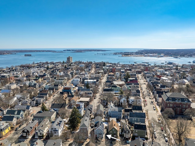 drone / aerial view with a residential view and a water view