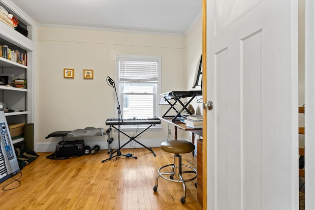 office space with hardwood / wood-style floors and ornamental molding