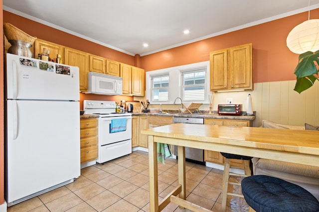 kitchen with light brown cabinets, crown molding, light tile patterned floors, white appliances, and a sink