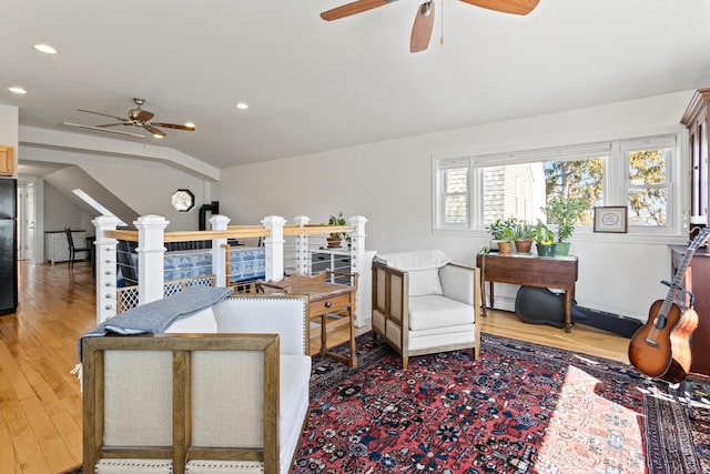 living area with recessed lighting, wood finished floors, and ceiling fan