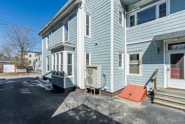 view of side of property featuring entry steps