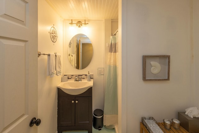 full bathroom with decorative backsplash and vanity