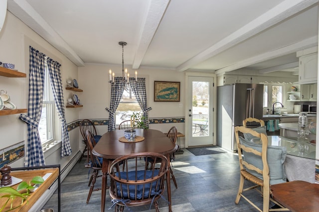 dining space with a chandelier, beamed ceiling, baseboard heating, and dark wood-style floors