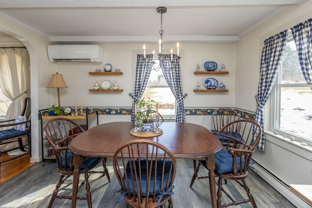 dining area with a healthy amount of sunlight, crown molding, and a wall mounted AC