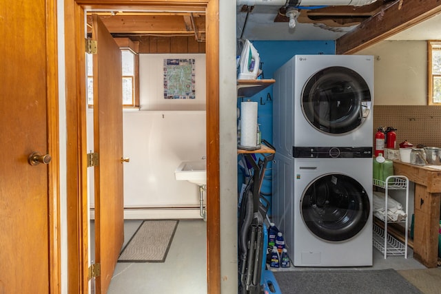 washroom with laundry area and stacked washing maching and dryer