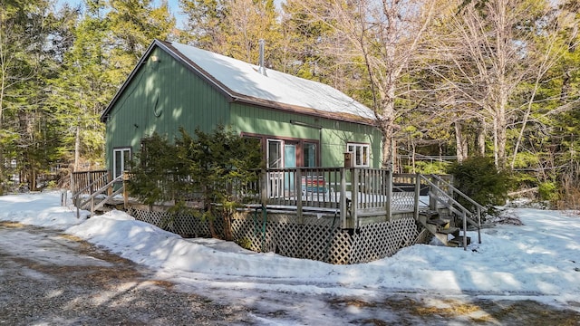 chalet / cabin featuring a deck