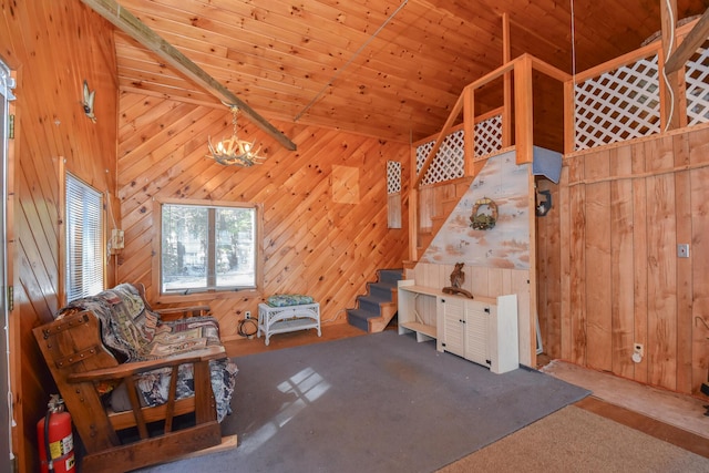 unfurnished room with wood walls, wood ceiling, stairs, an inviting chandelier, and high vaulted ceiling