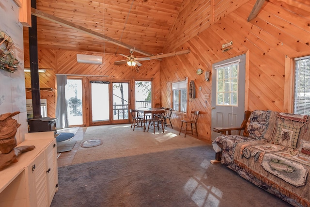 living area with high vaulted ceiling, an AC wall unit, carpet floors, wooden walls, and wooden ceiling