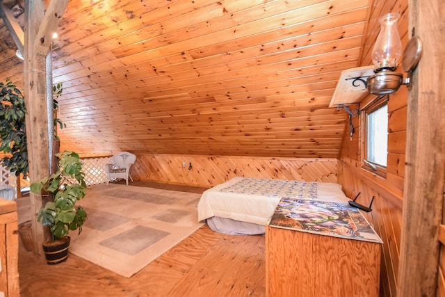 bedroom featuring wood walls