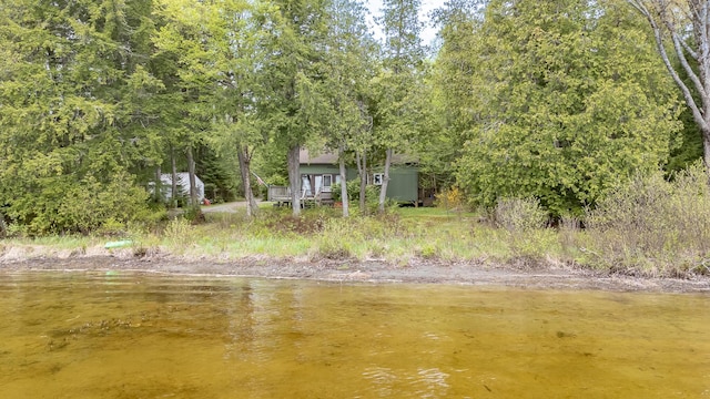 345 Tims Cove Rd, Willimantic, ME 04443 - view of yard with a water view