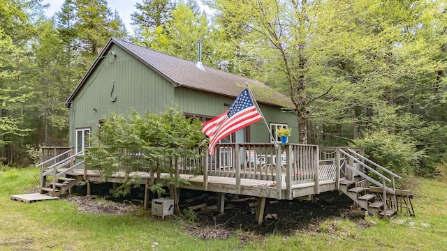 345 Tims Cove Rd, Willimantic, ME 04443 - back of house featuring a shingled roof, a deck, and stairs