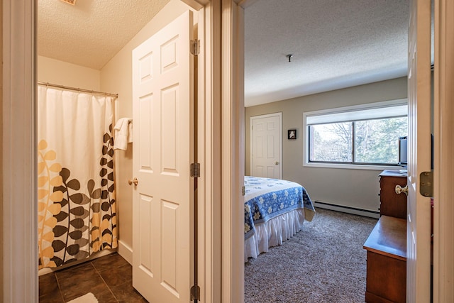 372 Skiway Rd Unit 204, Newry, ME 04261 - bedroom with a baseboard radiator and a textured ceiling