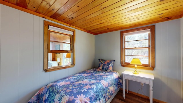 bedroom featuring wooden ceiling and wood finished floors