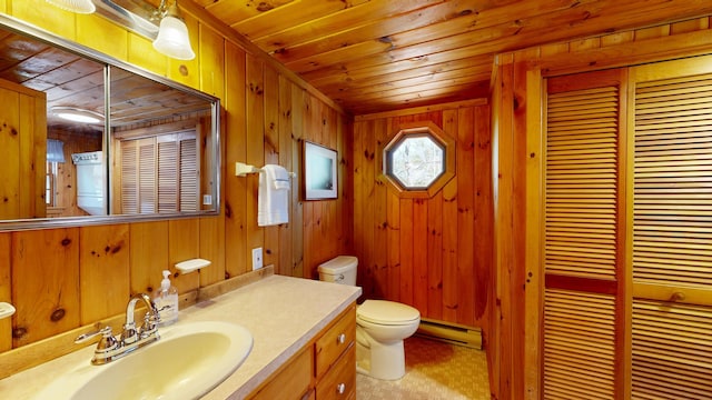 bathroom featuring wooden walls, wooden ceiling, a baseboard radiator, and toilet