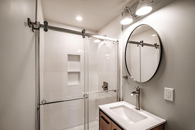 full bath with visible vents, a stall shower, and vanity