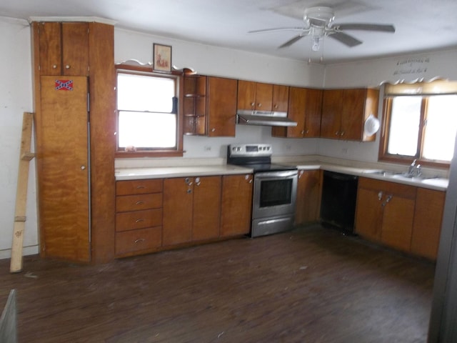 kitchen with under cabinet range hood, light countertops, black dishwasher, brown cabinets, and stainless steel range with electric cooktop