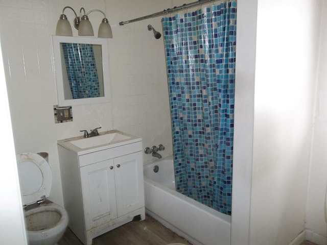 full bathroom featuring tile walls, toilet, shower / bath combo with shower curtain, wood finished floors, and vanity