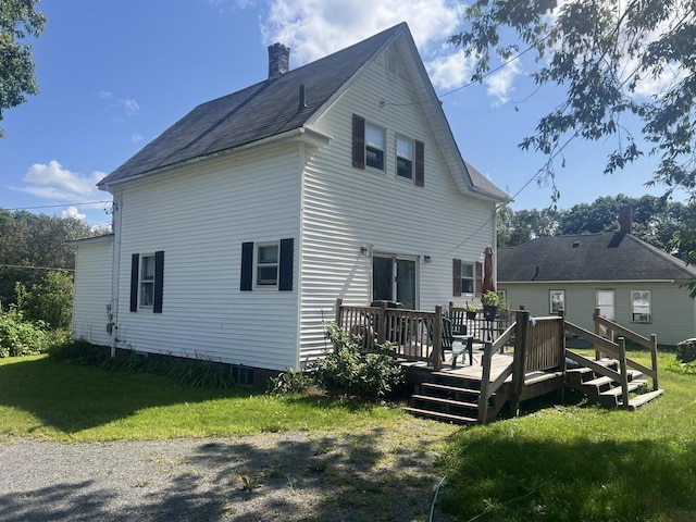 12 Pleasant St, Howland, ME 04448 - back of house with a yard, a deck, and a chimney