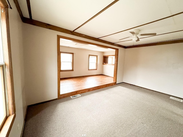 12 Pleasant St, Howland, ME 04448 - carpeted spare room with visible vents, baseboards, and ceiling fan